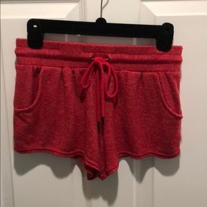 Out from under red shorts